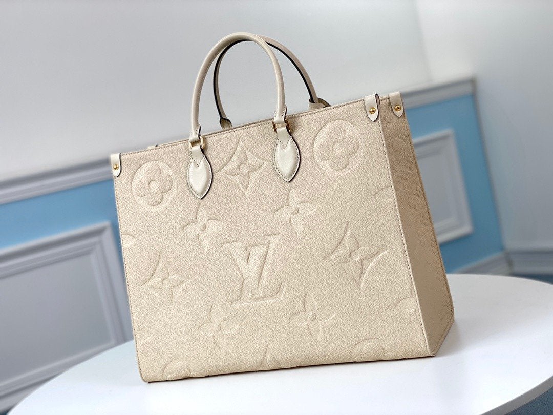 ONTHEGO GM 41 CREMA MONOGRAMA IMPRESO LONA GIGANTE