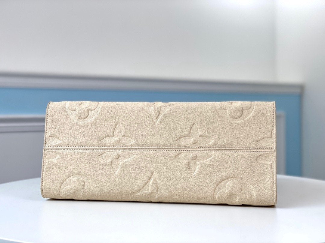 ONTHEGO GM 41 CREMA MONOGRAMA IMPRESO LONA GIGANTE