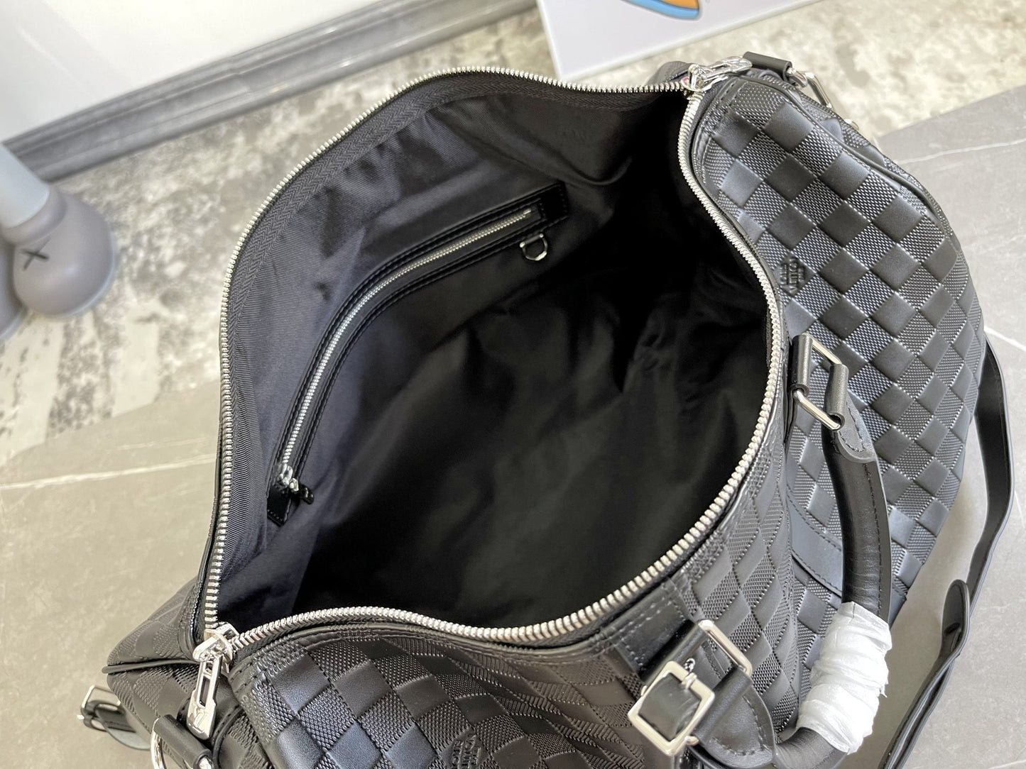KEEPALL 45 BANDOULIERE NOIR EMPREINTE INFINI