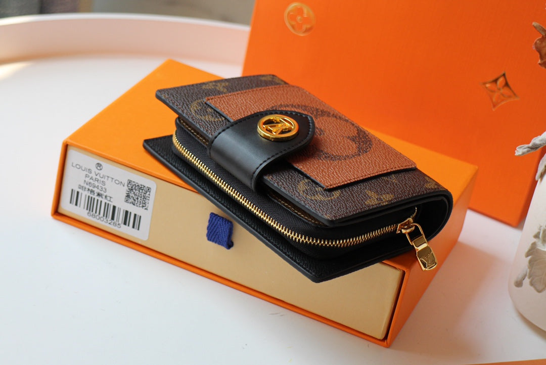 CARTERA JULIETTE 13.5 LONA MONOGRAMA MARRÓN NARANJA
