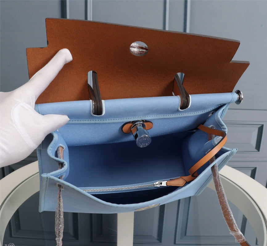 HM HERBAG ZIP 31 LONA CIELO Y BRONCE