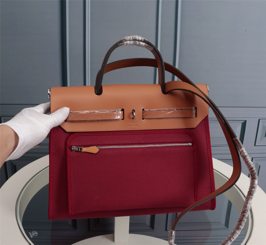 HM HERBAG ZIP 31 LONA ROJO VINO Y COBRE