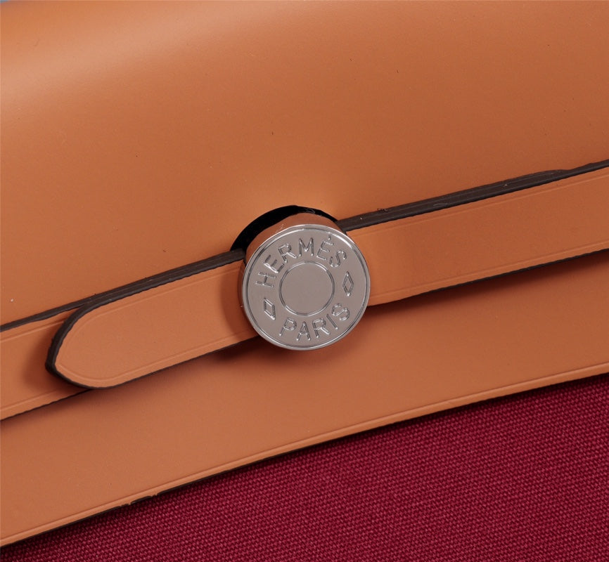 HM HERBAG ZIP 31 LONA ROJO VINO Y COBRE