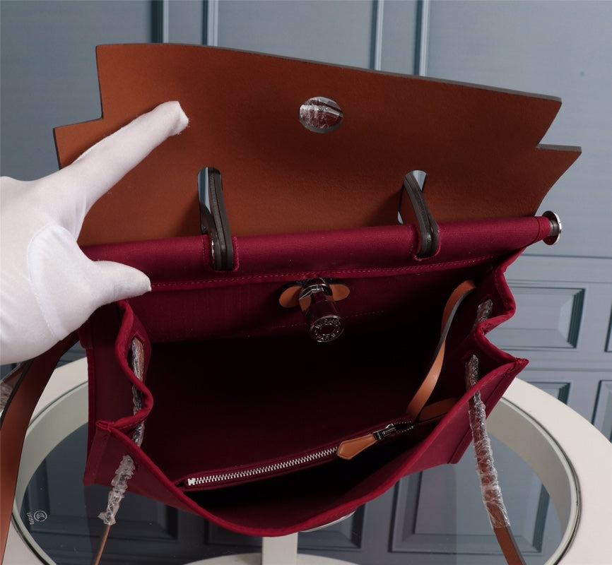 HM HERBAG ZIP 31 LONA ROJO VINO Y COBRE