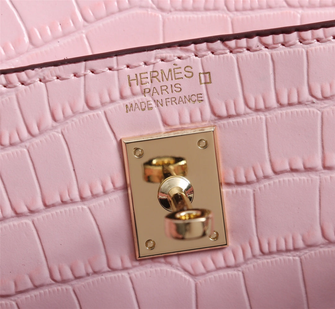 HM KELLY MINI 22 PIEL DE BECERRO REVESTIDA ROSA CLARO CON HERRAJES DORADOS