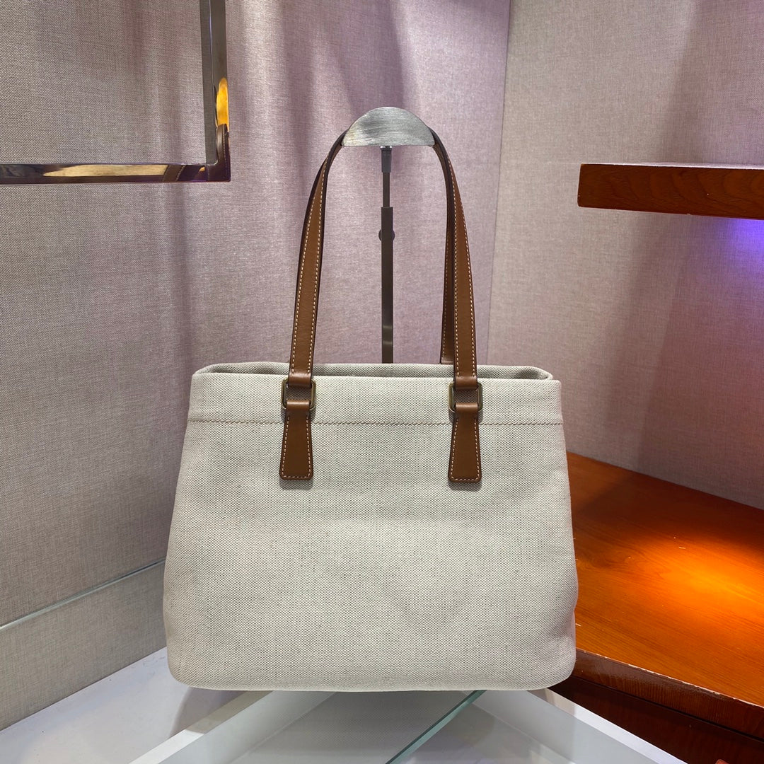 BOLSO TOTE 33 DE LONA BLANCA Y ASA DE PIEL DE BECERRO MARRÓN