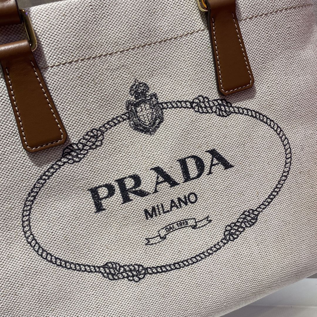BOLSO TOTE 33 DE LONA BLANCA Y ASA DE PIEL DE BECERRO MARRÓN