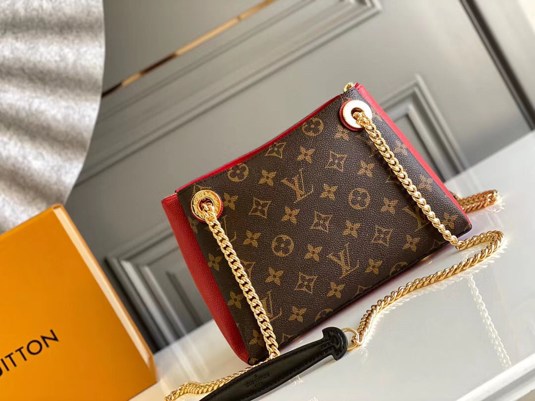 Bolso de hombro Surene BB de 24 cm con cadena y lona monograma de piel de becerro roja