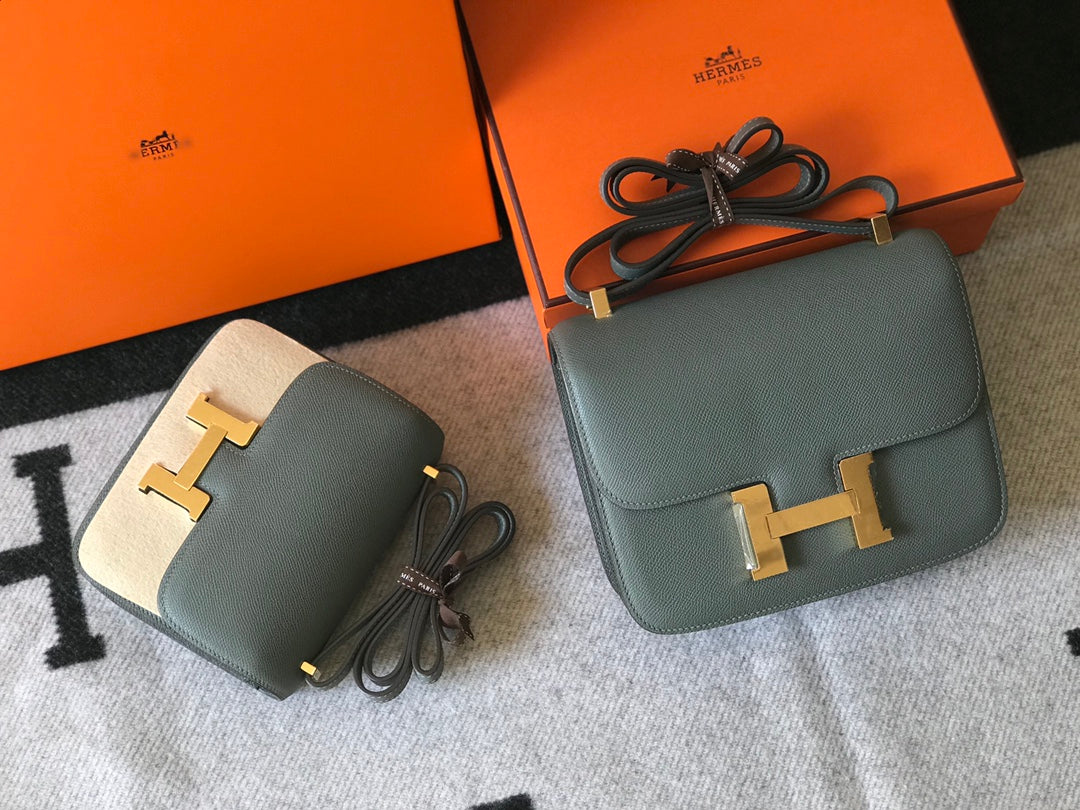 Constance 24 azul naranja, cuero Epsom, herrajes dorados