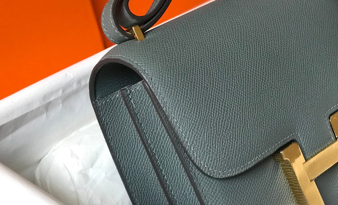 Constance 24 azul naranja, cuero Epsom, herrajes dorados