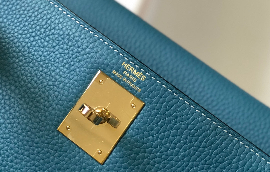 Hm Kelly 32 cm en cuir Togo bleu denim avec finitions dorées