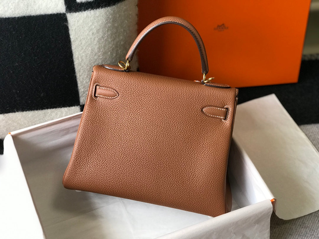 hm kelly 32 cm cuir togo doré accessoires dorés