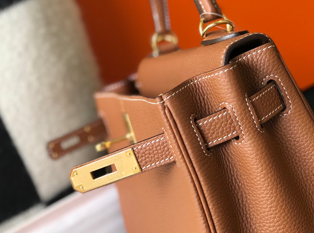 hm kelly 32 cm cuir togo doré accessoires dorés