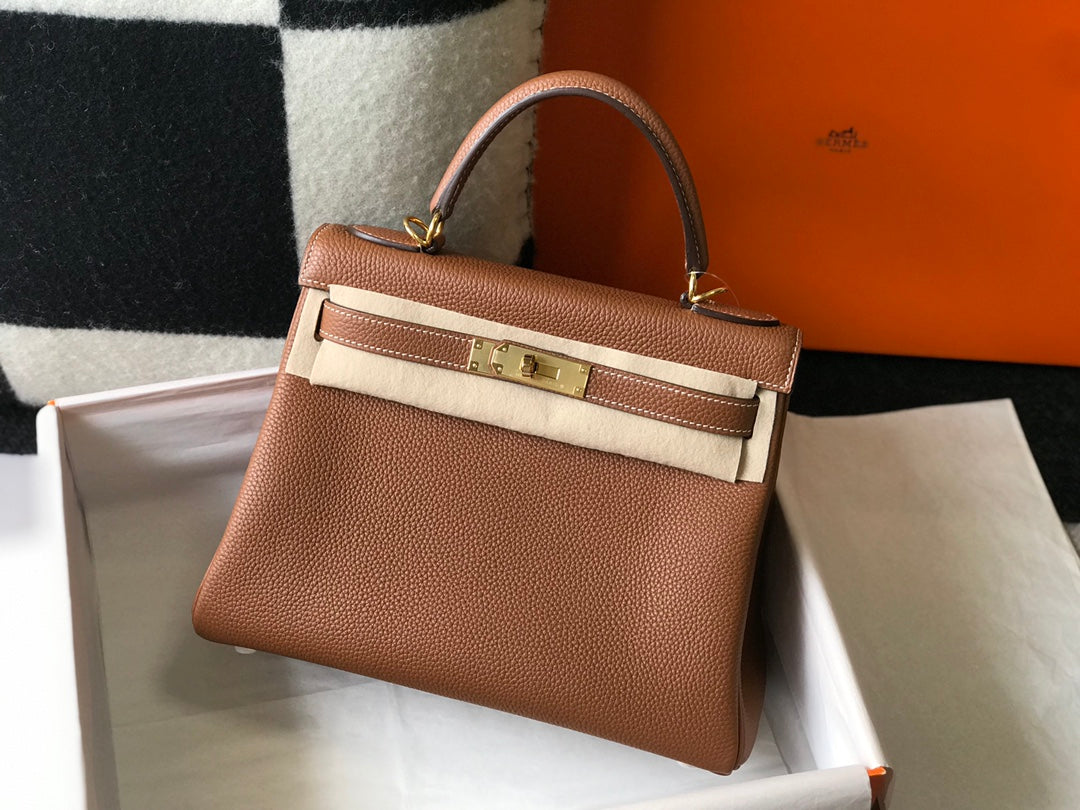 hm kelly 32 cm cuir togo doré accessoires dorés