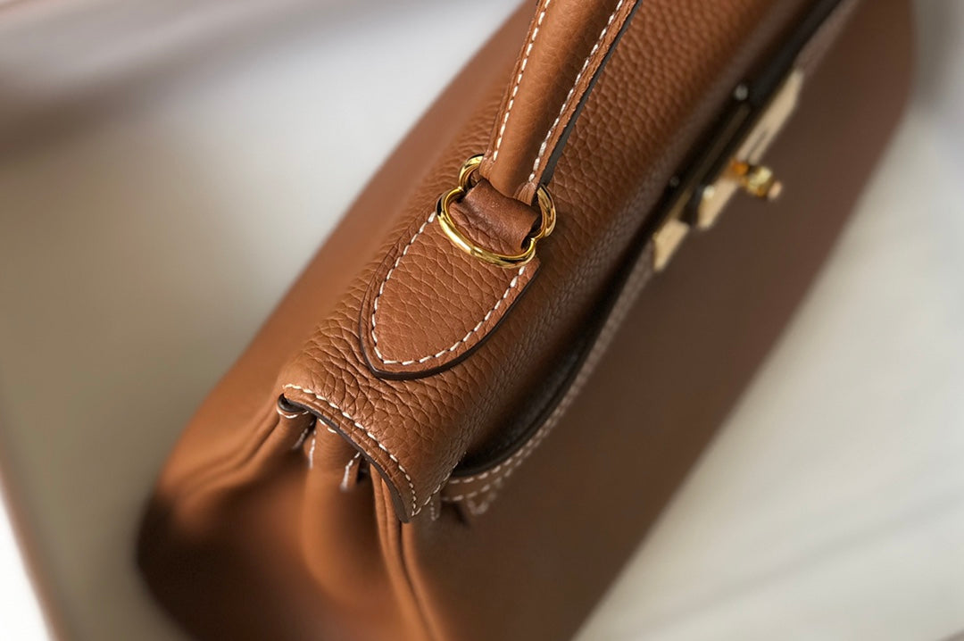 hm kelly 32 cm cuir togo doré accessoires dorés