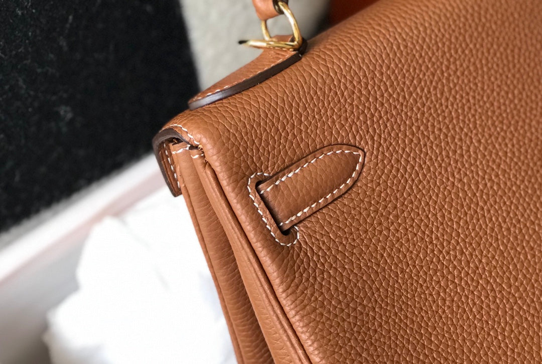 hm kelly 32 cm cuir togo doré accessoires dorés