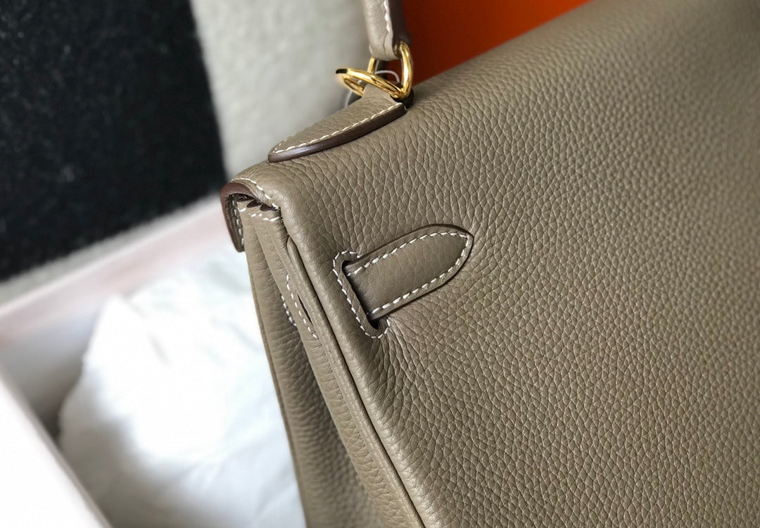 hm kelly 32 cm cuir togo taupe accessoires dorés