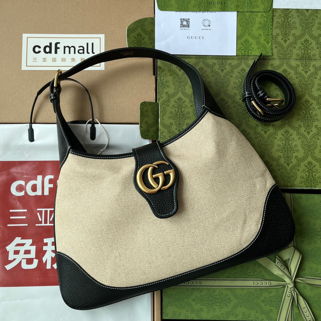 BOLSO MEDIANO APHRODITE 39 DE LONA BEIGE Y PIEL DE BECERRO NEGRA CON HERRAJES DORADOS