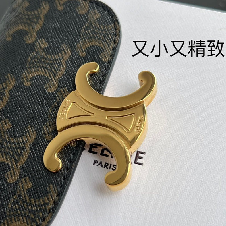 Sac à main Triomphe 11 en cuir de veau brillant à motifs noirs