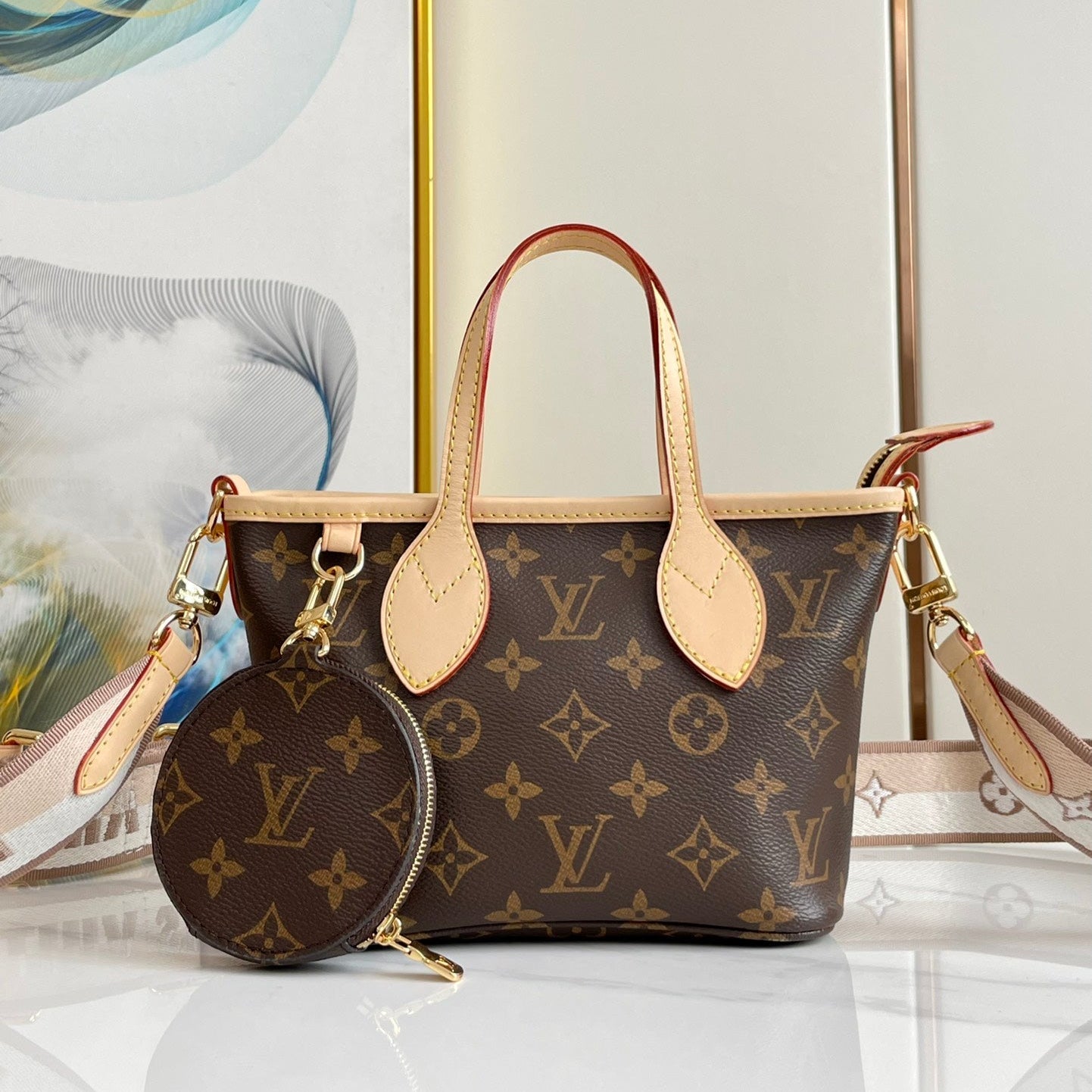 NEVERFULL BB 24 LONA CON MONOGRAMA MARRÓN Y ACABADOS DE CUERO, HERRAJES DORADOS