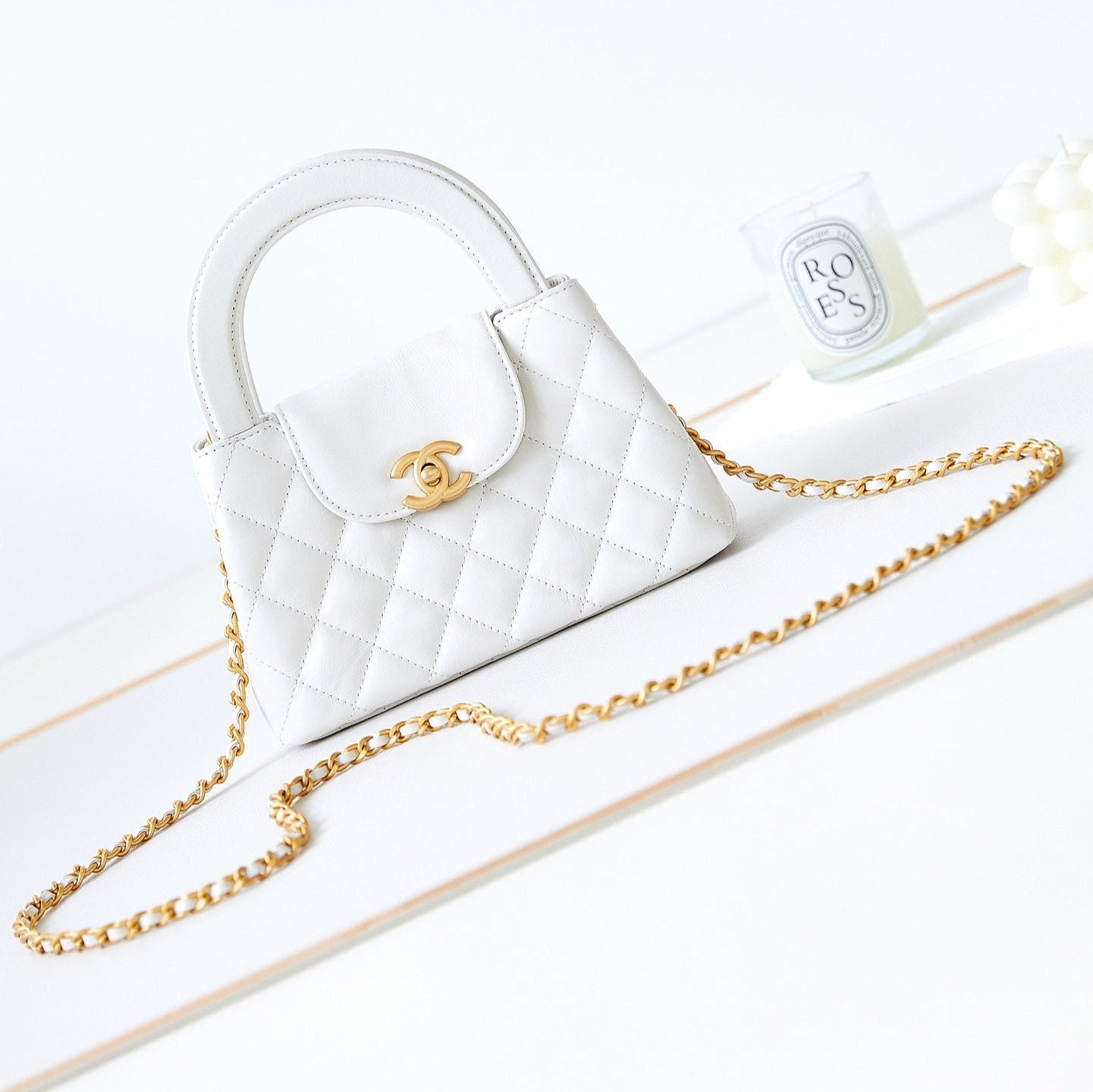 Bolso shopper Kelly CC 24A Nano de 19 cm en piel de cordero blanca