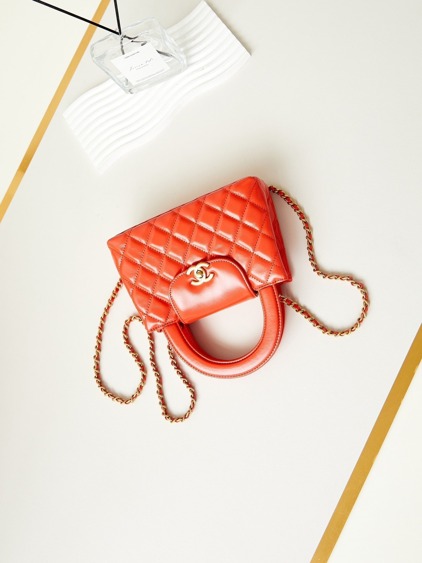 Sac cabas Kelly CC 24A Nano 19 cm en cuir d'agneau orange vif