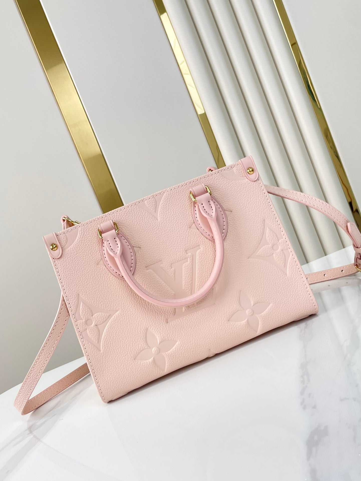 ONTHEGO PM 25 DE PIEL EMPREINTE MONOGRAMA ROSA OPALE