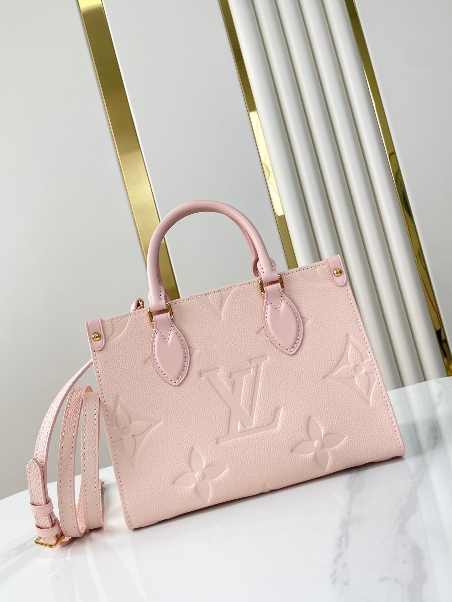 ONTHEGO PM 25 DE PIEL EMPREINTE MONOGRAMA ROSA OPALE