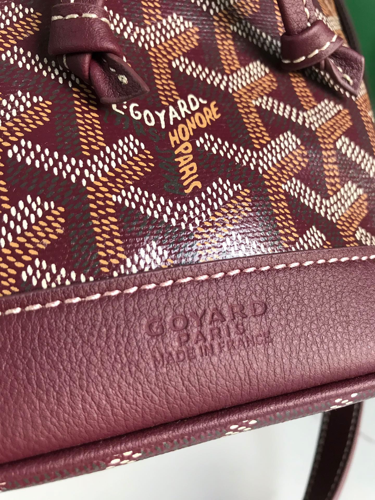 BOLSO CUBO PETIT FLOT 22 EN LONA GOYARDINE ROJO VINO Y RIBETE DE PIEL DE CORDERO
