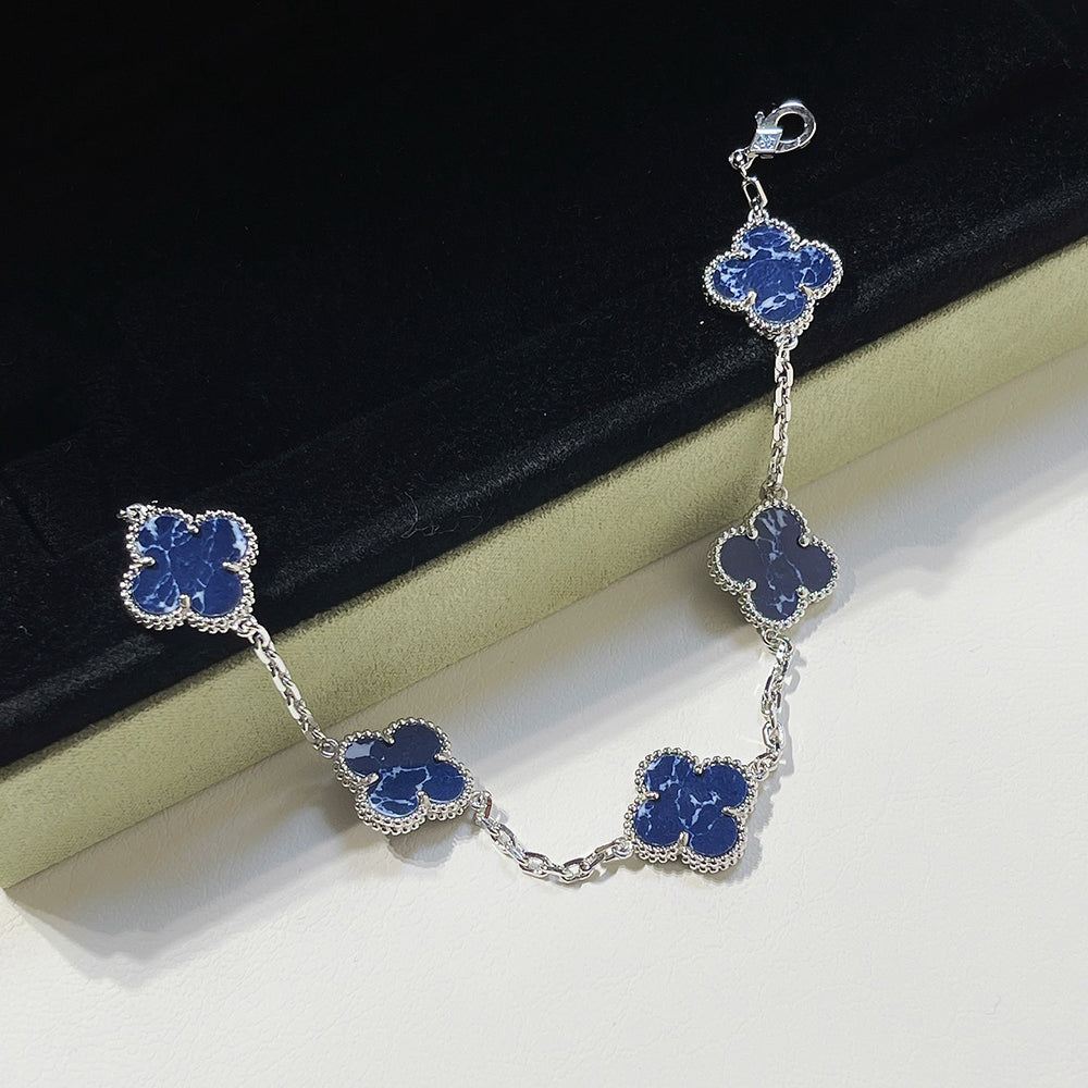 PULSERA DE PLATA DE PIETERSITA CON 5 MOTIVOS DE TRÉBOL DE DIANA
