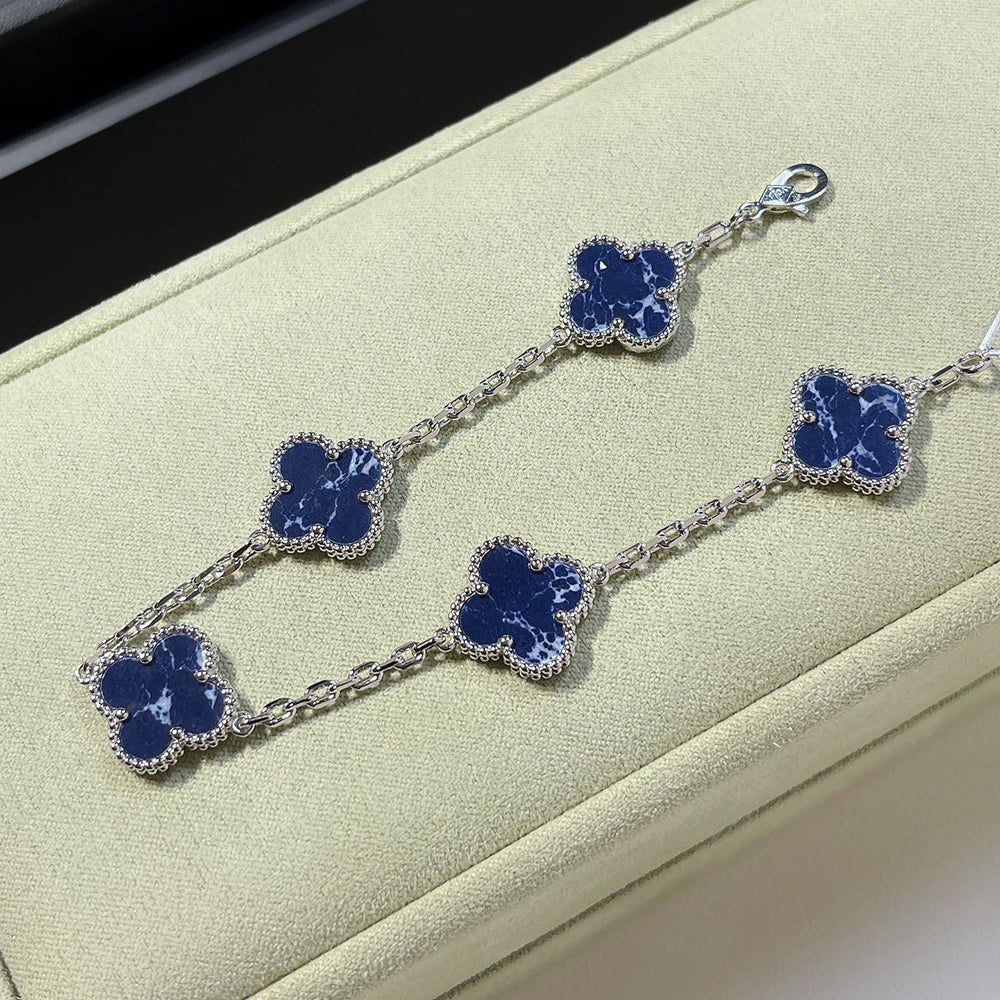 PULSERA DE PLATA DE PIETERSITA CON 5 MOTIVOS DE TRÉBOL DE DIANA
