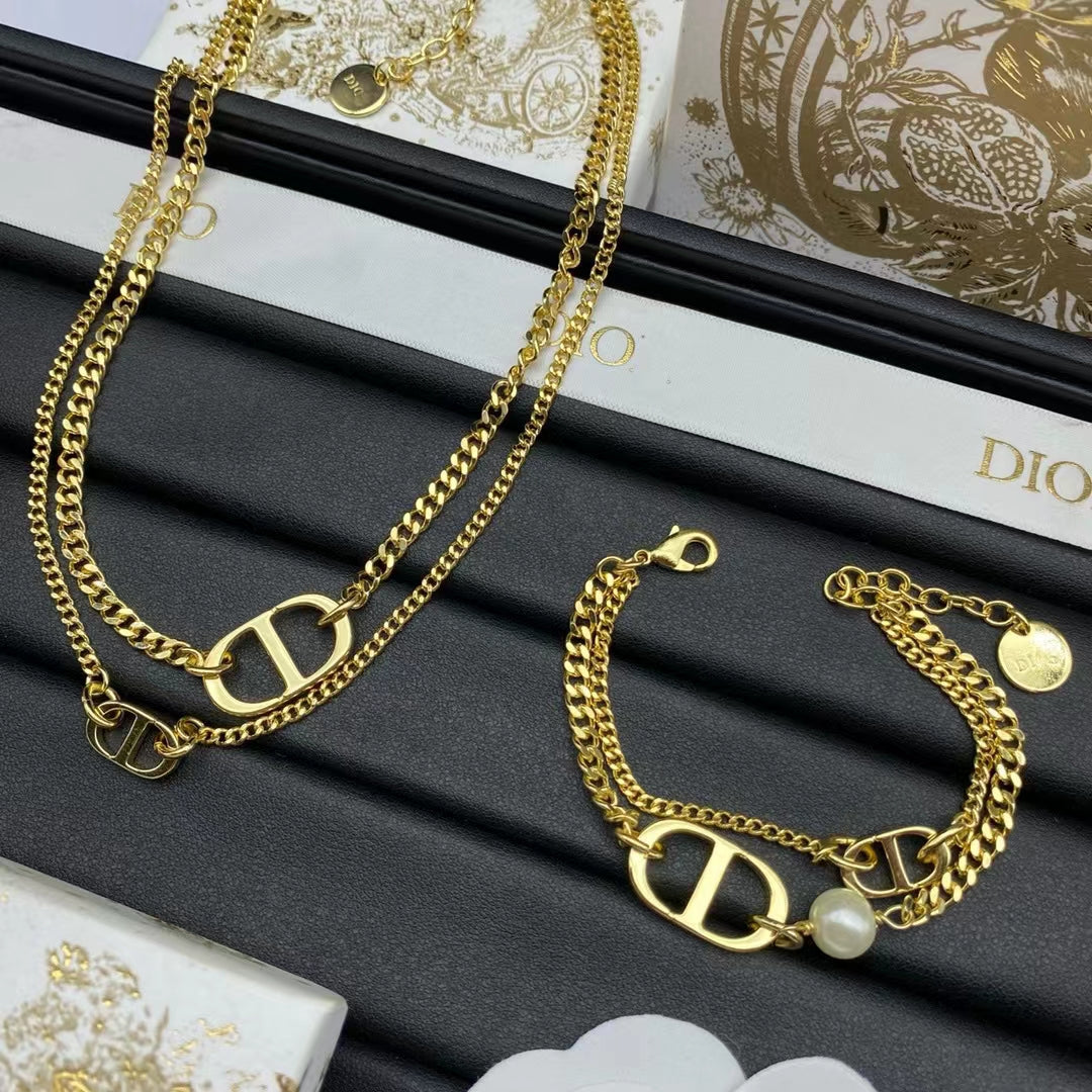 BRACELET DOUBLE CHAÎNE EN OR AVEC LOGO CD