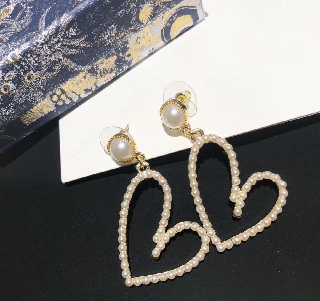 PENDIENTES DE CORAZÓN ABIERTO BAÑADOS EN ORO CON PERLA