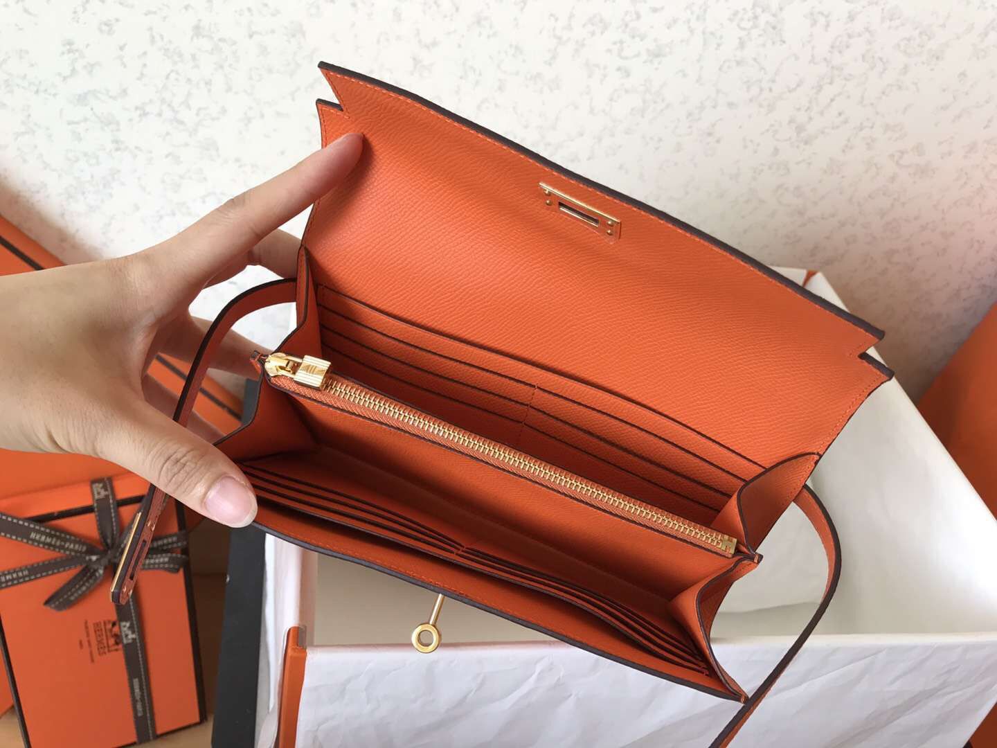 Cartera larga Kelly de 20 cm de piel Epsom naranja