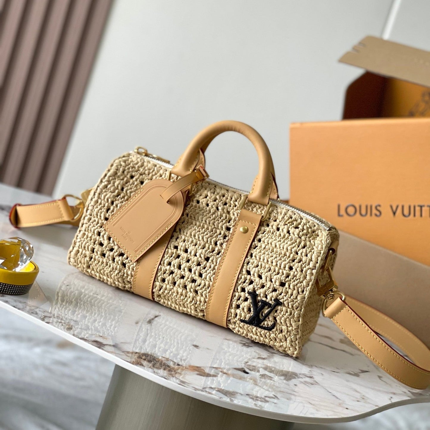 KEEPALL BANDOULI¨¨RE 25 EN RAFIA DE GANCHILLO BEIGE Y RIBETE DE PIEL DE BECERRO