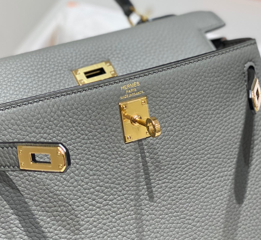 hm kelly 32 cm cuir togo gris accessoires dorés