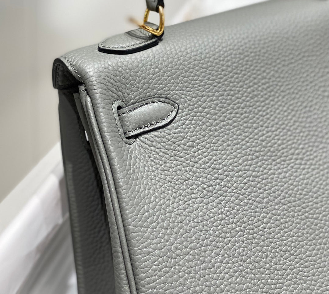 hm kelly 32 cm cuir togo gris accessoires dorés