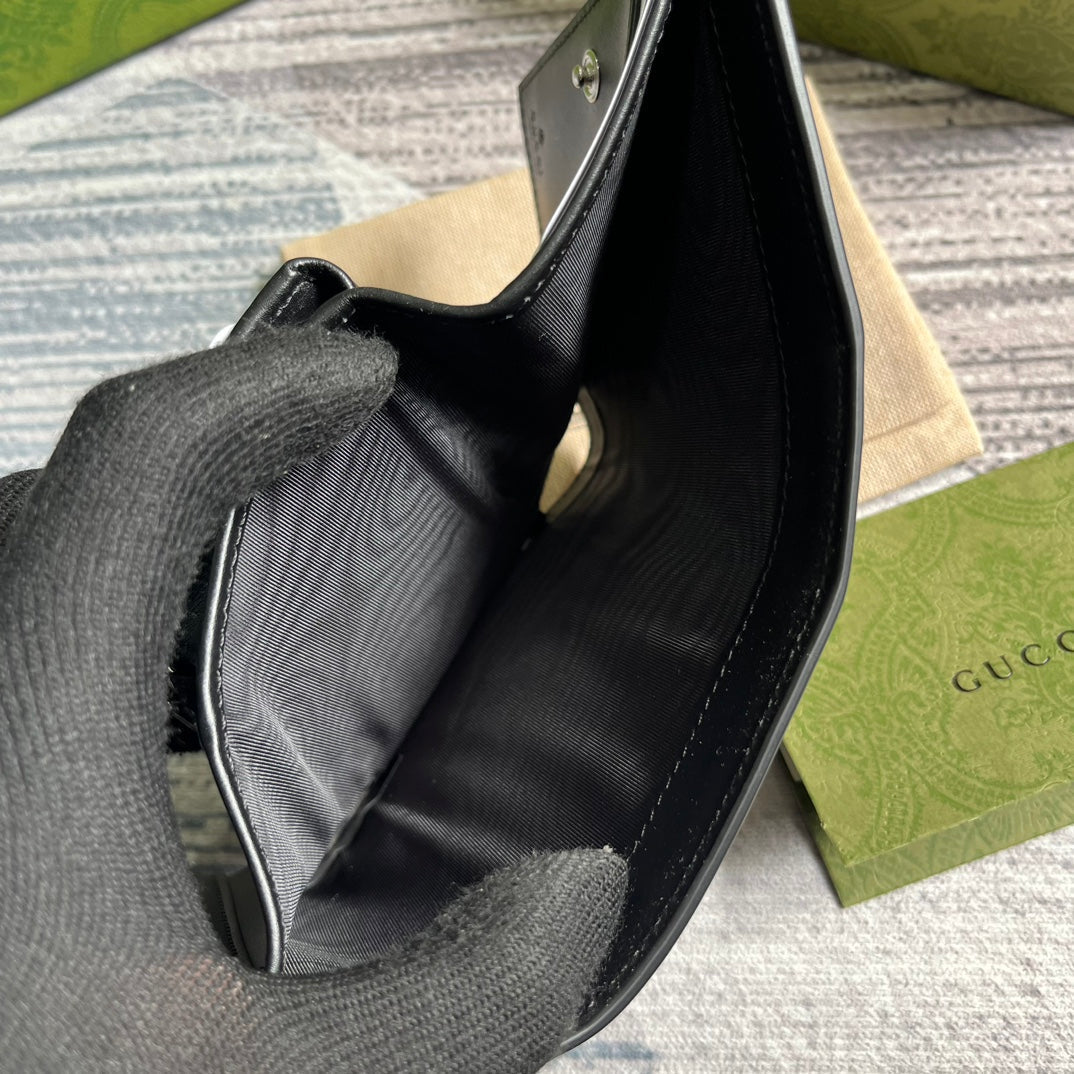 MINI CARTERA 11 EN PIEL DE BECERRO NEGRA