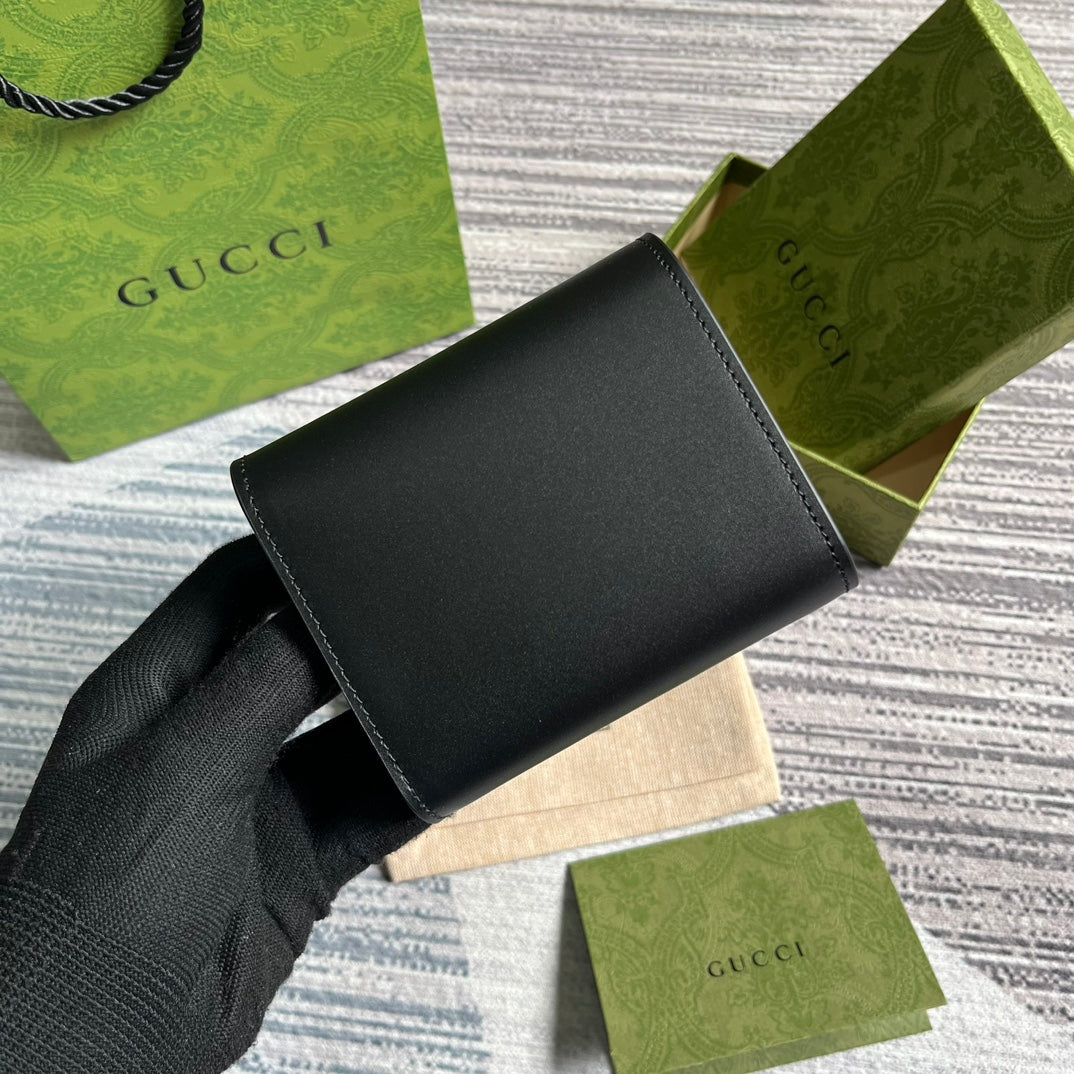 MINI CARTERA 11 EN PIEL DE BECERRO NEGRA