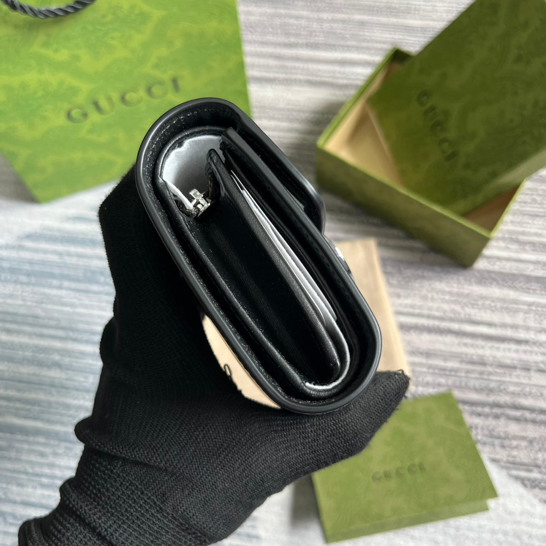 MINI CARTERA 11 EN PIEL DE BECERRO NEGRA