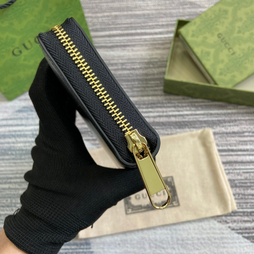 PORTEFEUILLE ZIPPÉ 20 EN CUIR DE VEAU NOIR QUINCAILLERIE DORÉ