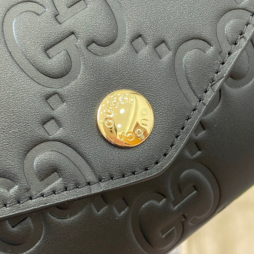 CARTERA CONTINENTAL 19 EN PIEL DE BECERRO REVESTIDA NEGRA CON HERRAJES DORADOS