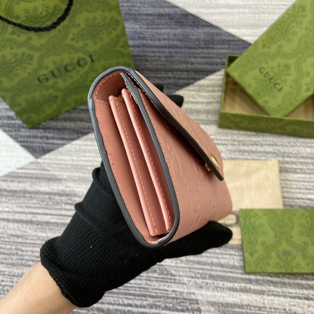 CARTERA CONTINENTAL 19 EN PIEL DE BECERRO REVESTIDA ROSA CON HERRAJES DORADOS
