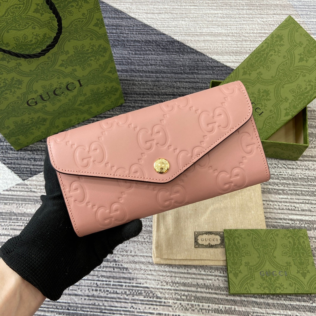 CARTERA CONTINENTAL 19 EN PIEL DE BECERRO REVESTIDA ROSA CON HERRAJES DORADOS