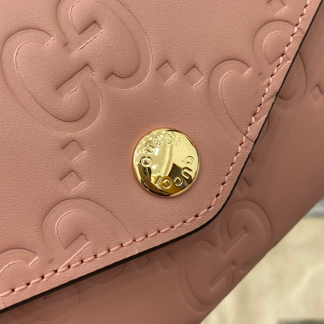 CARTERA CONTINENTAL 19 EN PIEL DE BECERRO REVESTIDA ROSA CON HERRAJES DORADOS