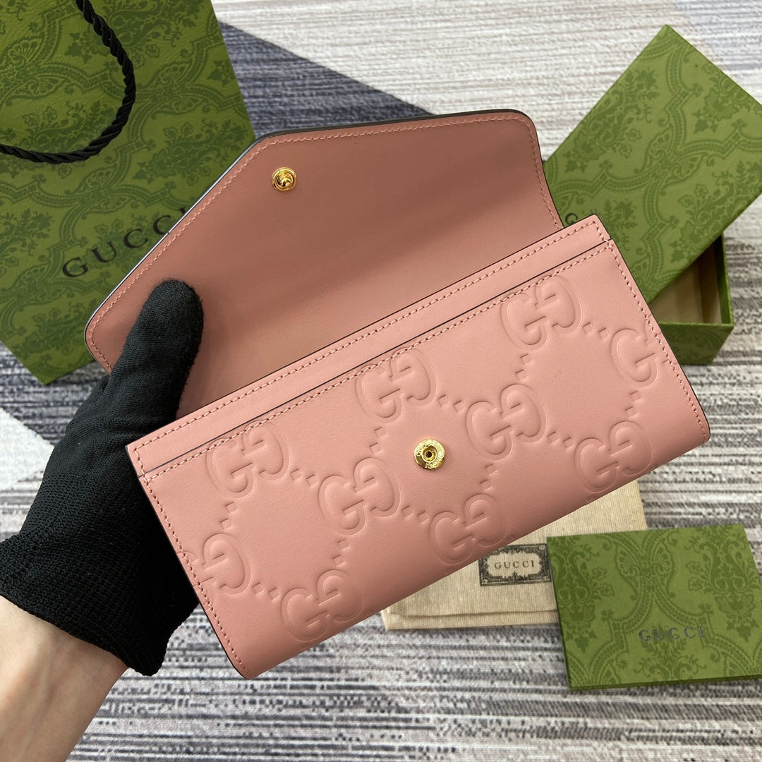 CARTERA CONTINENTAL 19 EN PIEL DE BECERRO REVESTIDA ROSA CON HERRAJES DORADOS