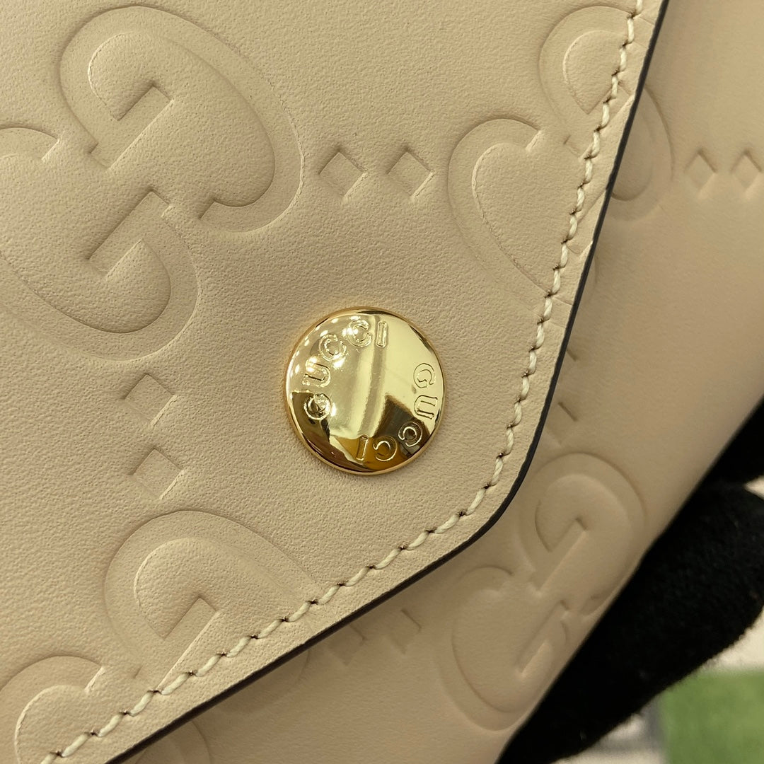 PORTEFEUILLE CONTINENTAL 19 EN CUIR DE VEAU GAUFRÉ JAUNE CLAIR, QUINCAILLERIE DORÉ