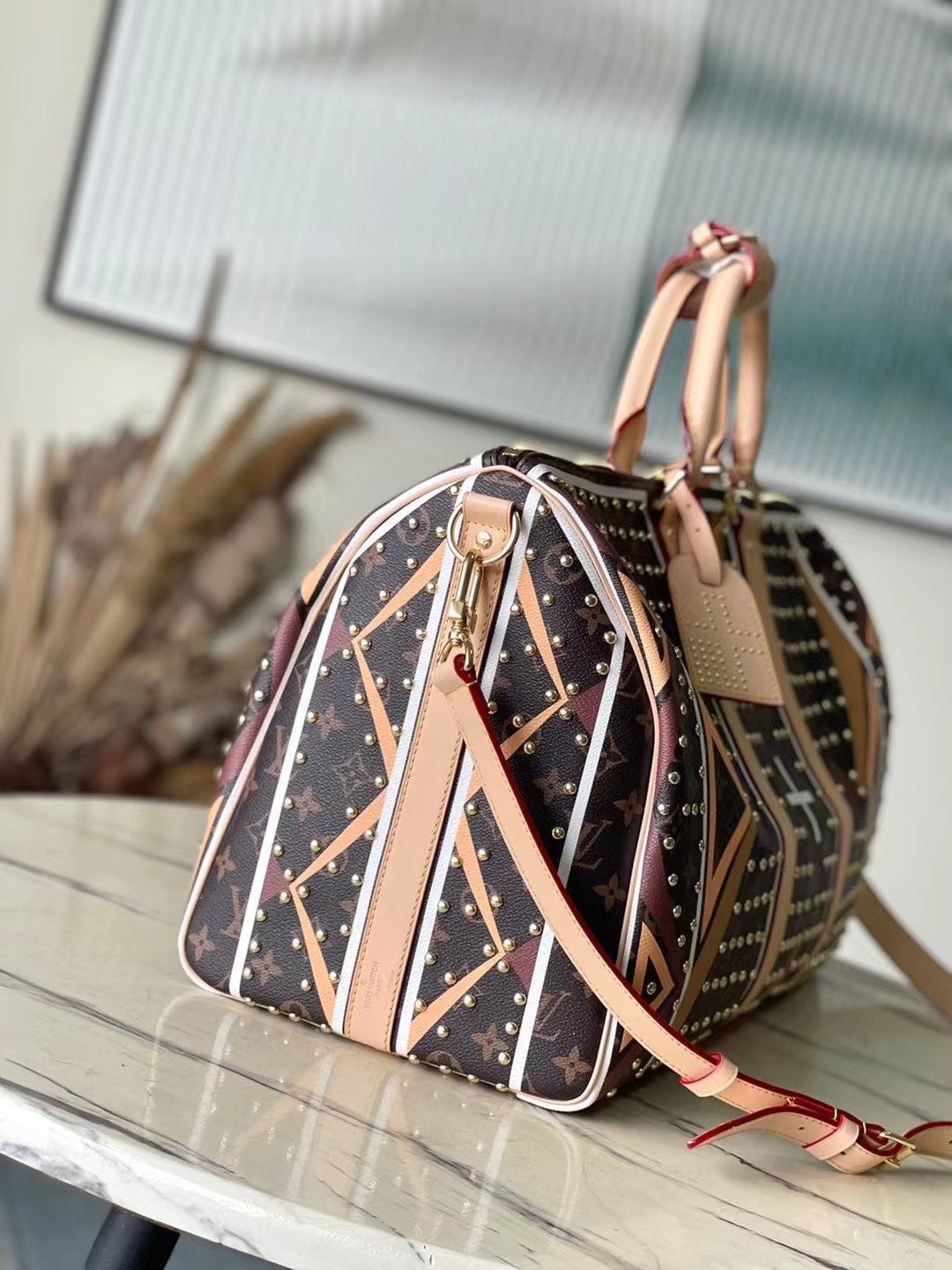KEEPALL BANDOULI¨¨RE 50 EN LONA CON MONOGRAMA Y PATRÓN DE PARFLECHE
