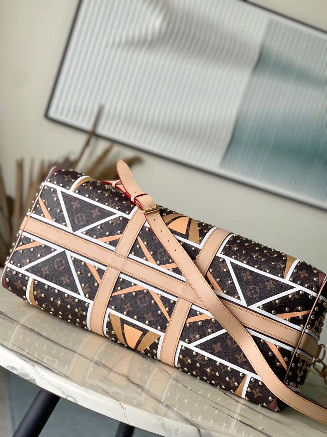 KEEPALL BANDOULI¨¨RE 50 EN LONA CON MONOGRAMA Y PATRÓN DE PARFLECHE