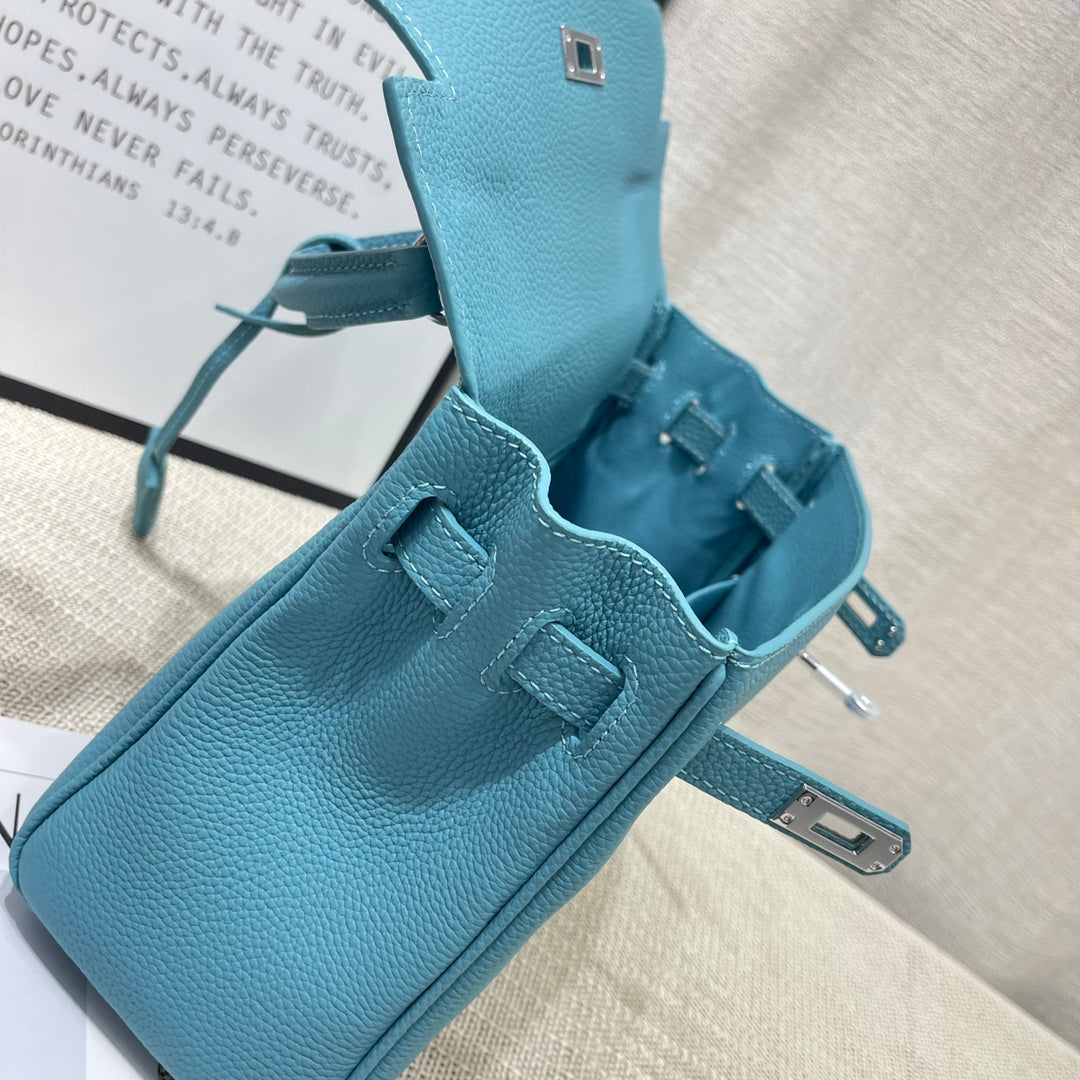 Bolso HM Kelly Retourne de 25 cm con piel de Togo turquesa y herrajes plateados